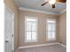 Spacious bedroom with neutral walls, carpet, and plantation shutters at 992 Pj East Rd, Covington, GA 30014
