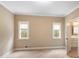 Bright bedroom featuring two windows and an ensuite bathroom at 992 Pj East Rd, Covington, GA 30014
