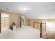 Bonus room with carpet flooring, built in closet, and access to bathroom at 992 Pj East Rd, Covington, GA 30014