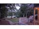 Deck overlooks a tranquil backyard and serene lake view at 992 Pj East Rd, Covington, GA 30014