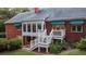 Spacious deck with stairs leading to the backyard at 992 Pj East Rd, Covington, GA 30014