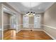 Bright dining room with hardwood floors and chandelier at 992 Pj East Rd, Covington, GA 30014