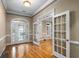 Elegant entryway with hardwood floors and French doors at 992 Pj East Rd, Covington, GA 30014