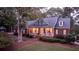 Brick house with front porch and landscaped yard at 992 Pj East Rd, Covington, GA 30014