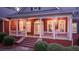 Charming front porch with rocking chairs and brick columns at 992 Pj East Rd, Covington, GA 30014