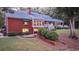 Brick house with deck, patio, and lush landscaping at 992 Pj East Rd, Covington, GA 30014