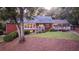 Brick house with a large deck and lush backyard at 992 Pj East Rd, Covington, GA 30014