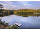 Scenic lakefront property with dock and pontoon boat at 992 Pj East Rd, Covington, GA 30014