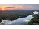 Stunning sunset over serene lake and lush landscape at 992 Pj East Rd, Covington, GA 30014