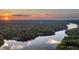 Stunning sunset over serene lake and lush landscape at 992 Pj East Rd, Covington, GA 30014