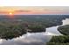 Stunning sunset over serene lake and lush landscape at 992 Pj East Rd, Covington, GA 30014