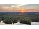 Stunning sunset over serene lake and lush landscape at 992 Pj East Rd, Covington, GA 30014