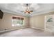 Large main bedroom with lake view and ceiling fan at 992 Pj East Rd, Covington, GA 30014