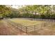 Fenced riding arena with gates at 992 Pj East Rd, Covington, GA 30014