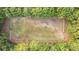 Aerial view of a riding arena surrounded by trees at 992 Pj East Rd, Covington, GA 30014