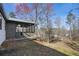 Back of house featuring screened in porch with yard area partially fenced-in and a gentle slope at 1507 Forest Ct, Woodstock, GA 30188