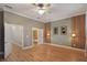 Spacious bedroom with hardwood floors and ceiling fan at 340 Town Center Ave # 215, Suwanee, GA 30024