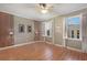 The bedroom features wood floors, lots of natural light, and custom wall design at 340 Town Center Ave # 215, Suwanee, GA 30024