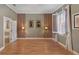 The bedroom boasts light-filled windows, wood floors, and a decorative accent wall at 340 Town Center Ave # 215, Suwanee, GA 30024