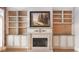 Elegant fireplace with built-in shelving and hardwood floors at 340 Town Center Ave # 215, Suwanee, GA 30024