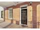 Charming front door of this brick home featuring a well-manicured lawn and welcoming entrance at 340 Town Center Ave # 215, Suwanee, GA 30024