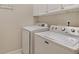 Laundry room with washer and dryer included at 340 Town Center Ave # 215, Suwanee, GA 30024