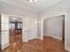 A transitional space featuring hardwood floors and doorway openings at 340 Town Center Ave # 215, Suwanee, GA 30024