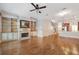 Spacious living room with hardwood floors, fireplace, and built-in bookshelves, perfect for relaxation and entertainment at 340 Town Center Ave # 215, Suwanee, GA 30024