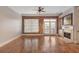 Inviting living room with hardwood floors, fireplace, and French doors leading to outdoor space at 340 Town Center Ave # 215, Suwanee, GA 30024