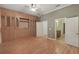 Spacious main bedroom with custom built-ins and wood floors is full of natural light at 340 Town Center Ave # 215, Suwanee, GA 30024