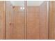 The renovated tiled shower features a glass enclosure and modern fixtures at 340 Town Center Ave # 215, Suwanee, GA 30024