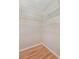 Organized walk-in closet with multiple white wire shelves, providing ample storage for clothing and accessories at 340 Town Center Ave # 215, Suwanee, GA 30024