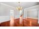 Bright dining room with hardwood floors and wainscoting at 1158 Mitford Ln, Dacula, GA 30019