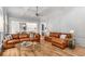 Spacious living room with a cozy sectional sofa and hardwood floors at 3156 E Addison Dr, Alpharetta, GA 30022