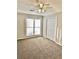 Spacious bedroom with carpet, ceiling fan and large windows at 553 W Sandtown Sw Rd, Marietta, GA 30064