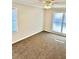 Well-lit bedroom with carpet and ceiling fan at 553 W Sandtown Sw Rd, Marietta, GA 30064