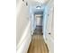 Hallway with light walls and wood-look flooring at 553 W Sandtown Sw Rd, Marietta, GA 30064