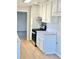 Modern kitchen with white cabinets and stainless steel appliances at 553 W Sandtown Sw Rd, Marietta, GA 30064