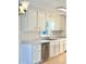 White kitchen cabinets and stainless steel appliances at 553 W Sandtown Sw Rd, Marietta, GA 30064