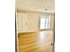 Spacious living room with light wood flooring and large windows at 553 W Sandtown Sw Rd, Marietta, GA 30064