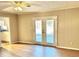 Living room with hardwood floors and sliding glass doors to patio at 553 W Sandtown Sw Rd, Marietta, GA 30064