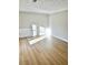 Bright living room with light walls and wood-look flooring at 553 W Sandtown Sw Rd, Marietta, GA 30064