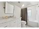 White bathroom with marble vanity, subway tile, and soaking tub at 3790 Narmore Ne Dr, Atlanta, GA 30319