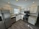 Updated kitchen with stainless steel appliances and granite countertops at 4000 Tall Pine Dr, Marietta, GA 30062