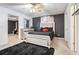 Spacious basement bedroom with a large bed and dresser at 405 Marvin Ct, Mcdonough, GA 30252
