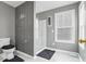 Modern bathroom with gray walls and a walk-in shower at 405 Marvin Ct, Mcdonough, GA 30252