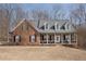 Brick house with front porch and large windows at 405 Marvin Ct, Mcdonough, GA 30252