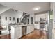 Open kitchen with white cabinets and island at 405 Marvin Ct, Mcdonough, GA 30252