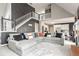 Spacious living room with a large sectional sofa and fireplace at 405 Marvin Ct, Mcdonough, GA 30252