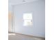 Bright bedroom with a window and carpeted floor at 575 Rockwell Sw St, Atlanta, GA 30310